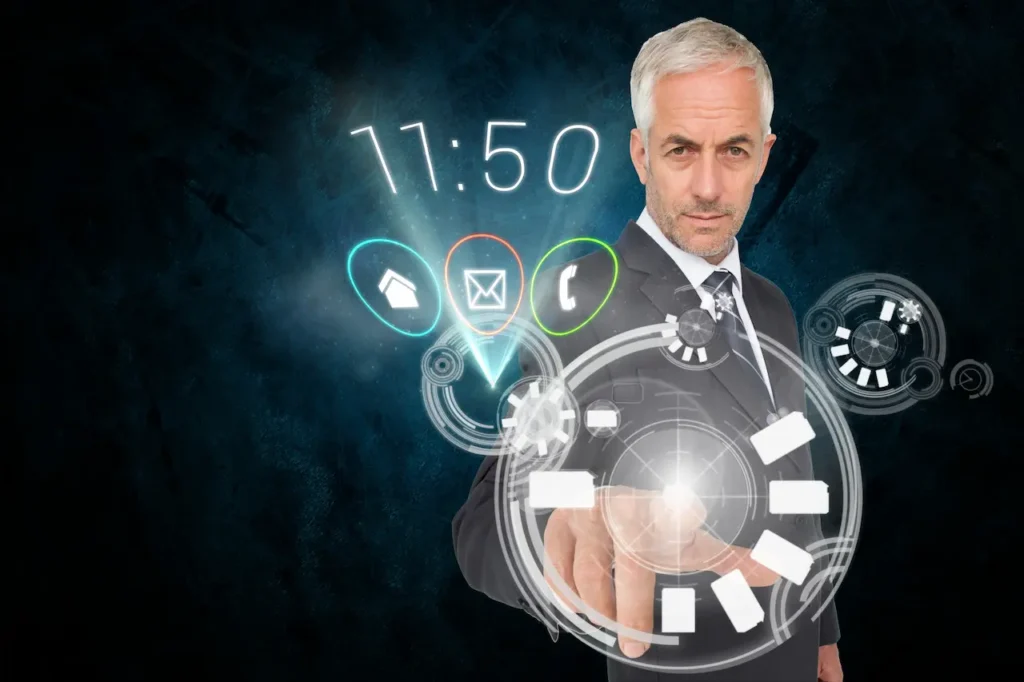 Businessman in a suit interacting with a virtual screen displaying various digital icons and graphs, with a time of 11:50 showing on the screen.